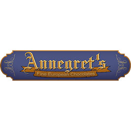 Purple, yellow, and orange-brown logo for Annegret's chocolate, one of the businesses located at the District on Bernard in Kelowna